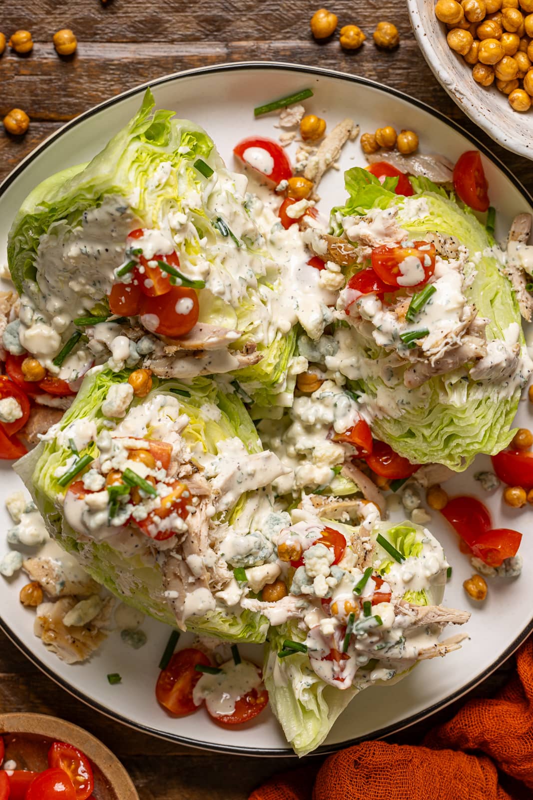 Up close shot of wedge salads on a white platter.