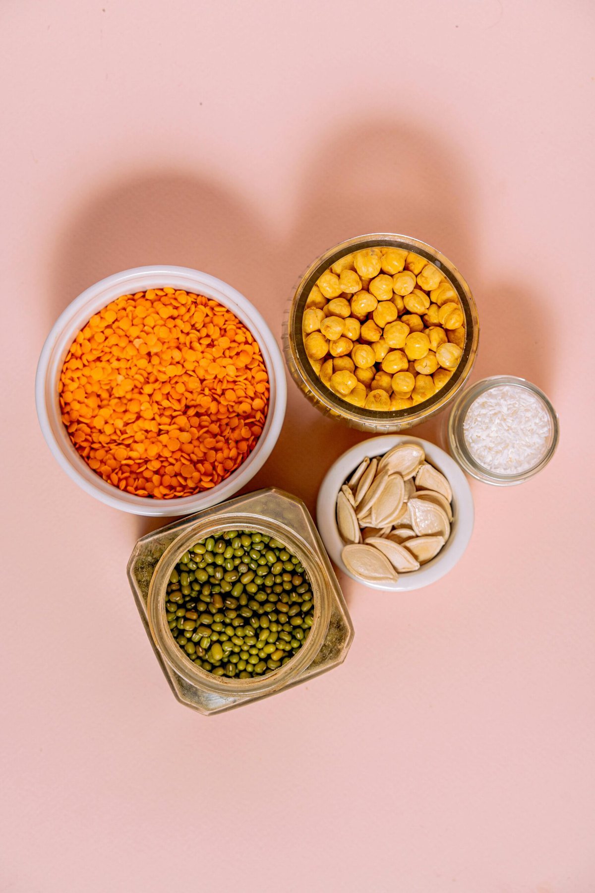 Bowl and jars of dry beans and legumes.