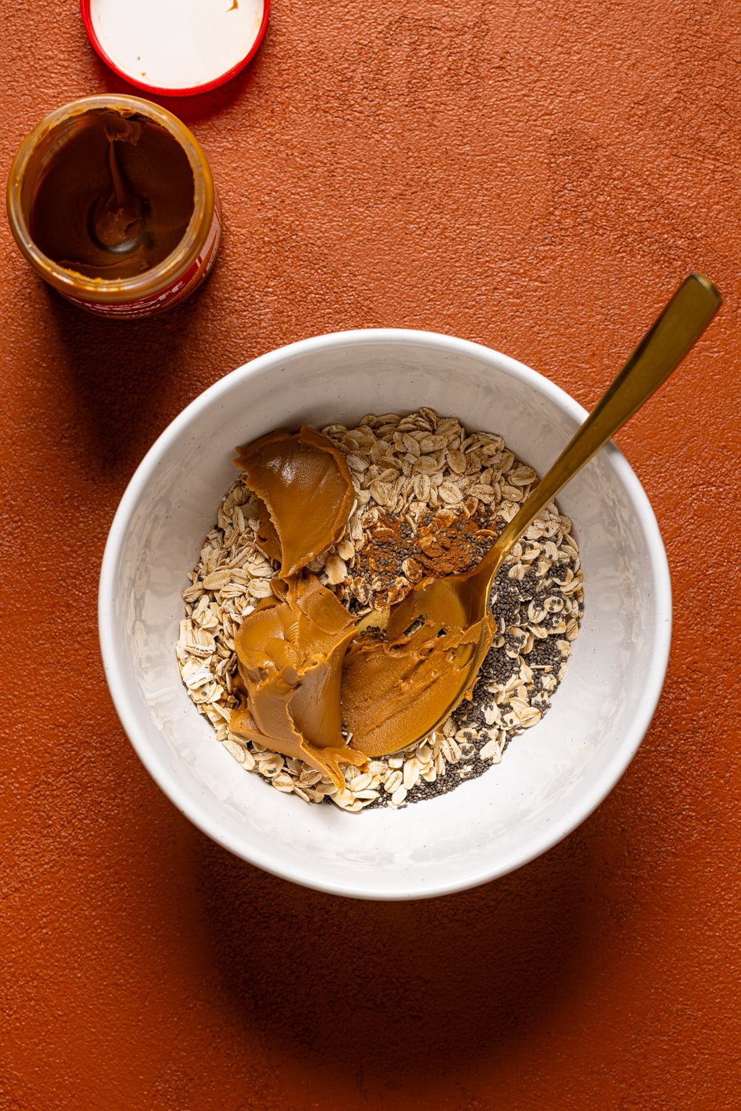 Ingredients in a white bowl with a spoon.