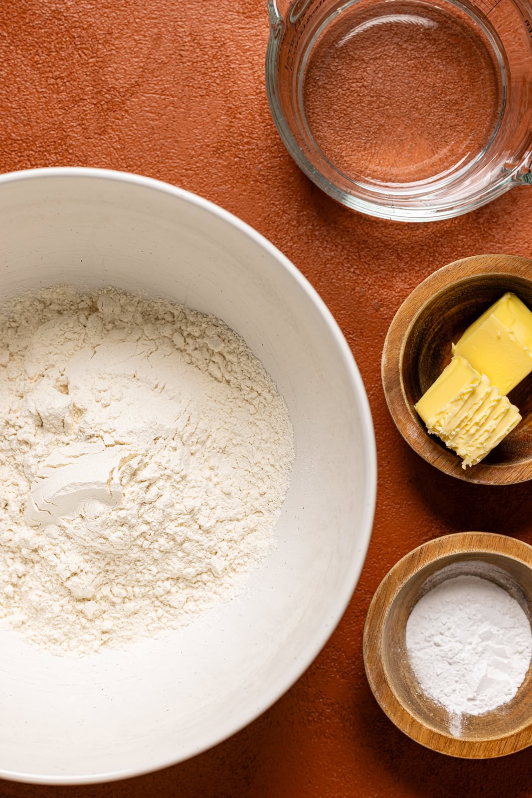 Ingredients on a burnt orange table.