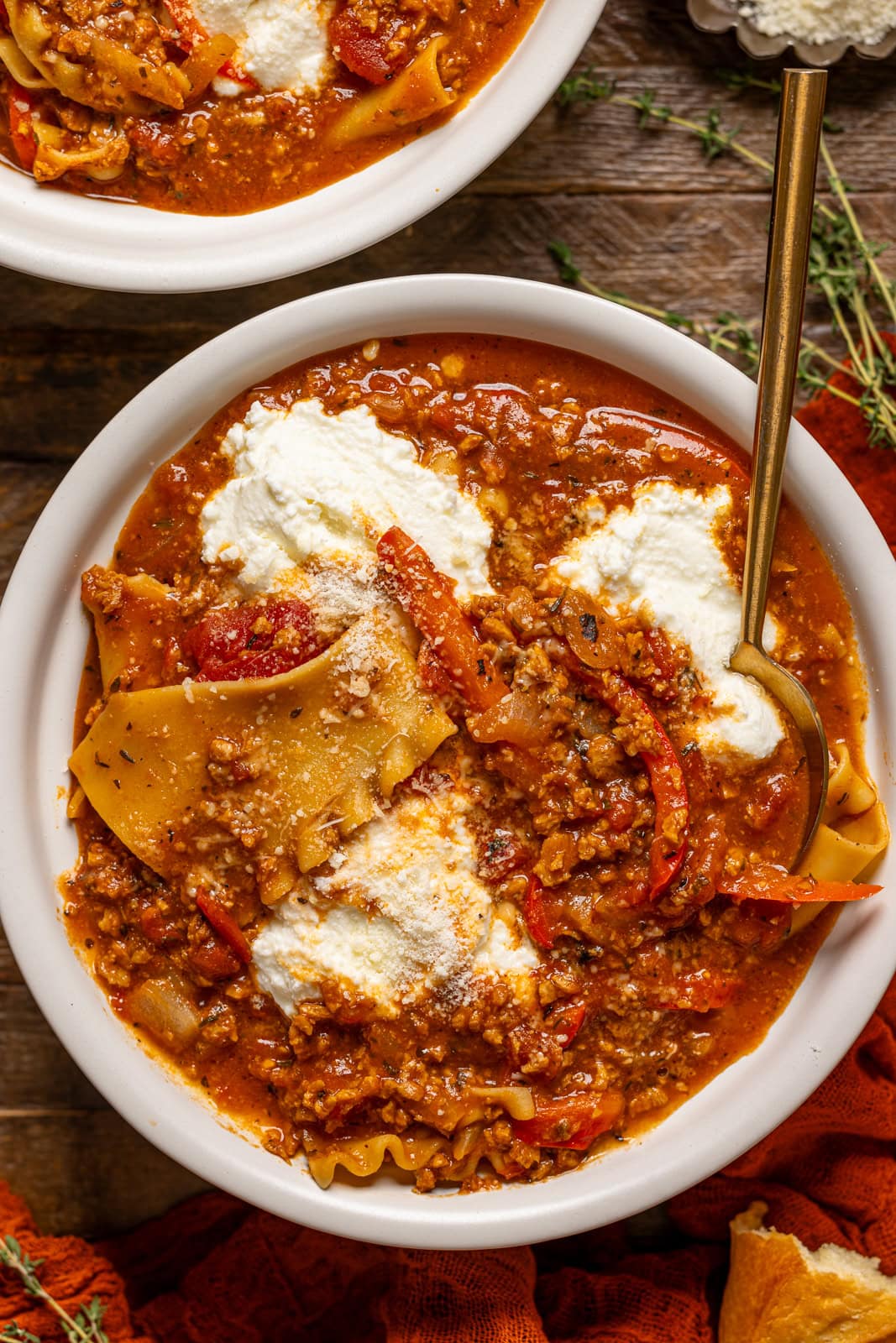 Up close shot of the lasagna soup in a bowl with a spoon.