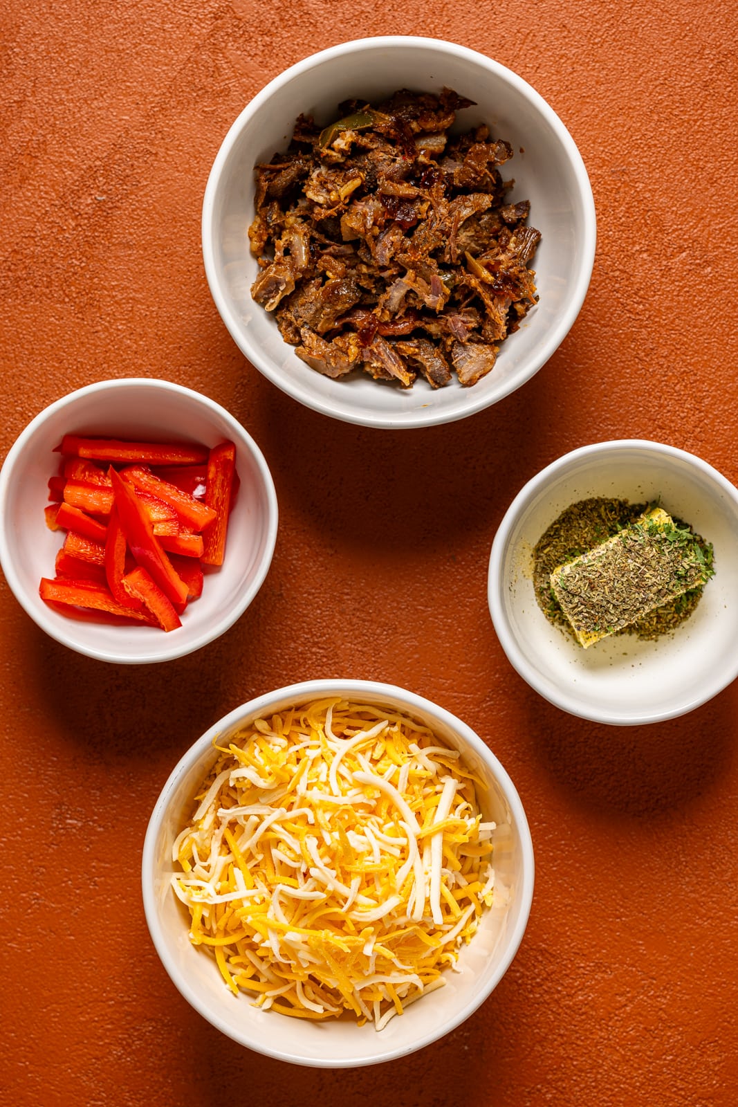 Ingredients on a burnt orange table.