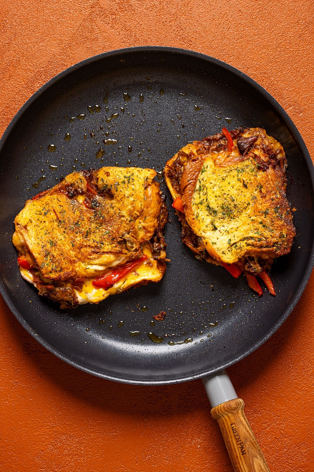 Grilled cheese sandwiches in a skillet.