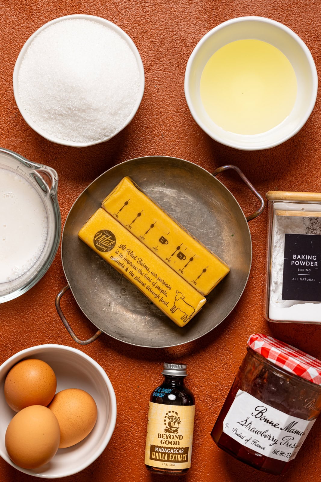 Ingredients on a burnt orange table.