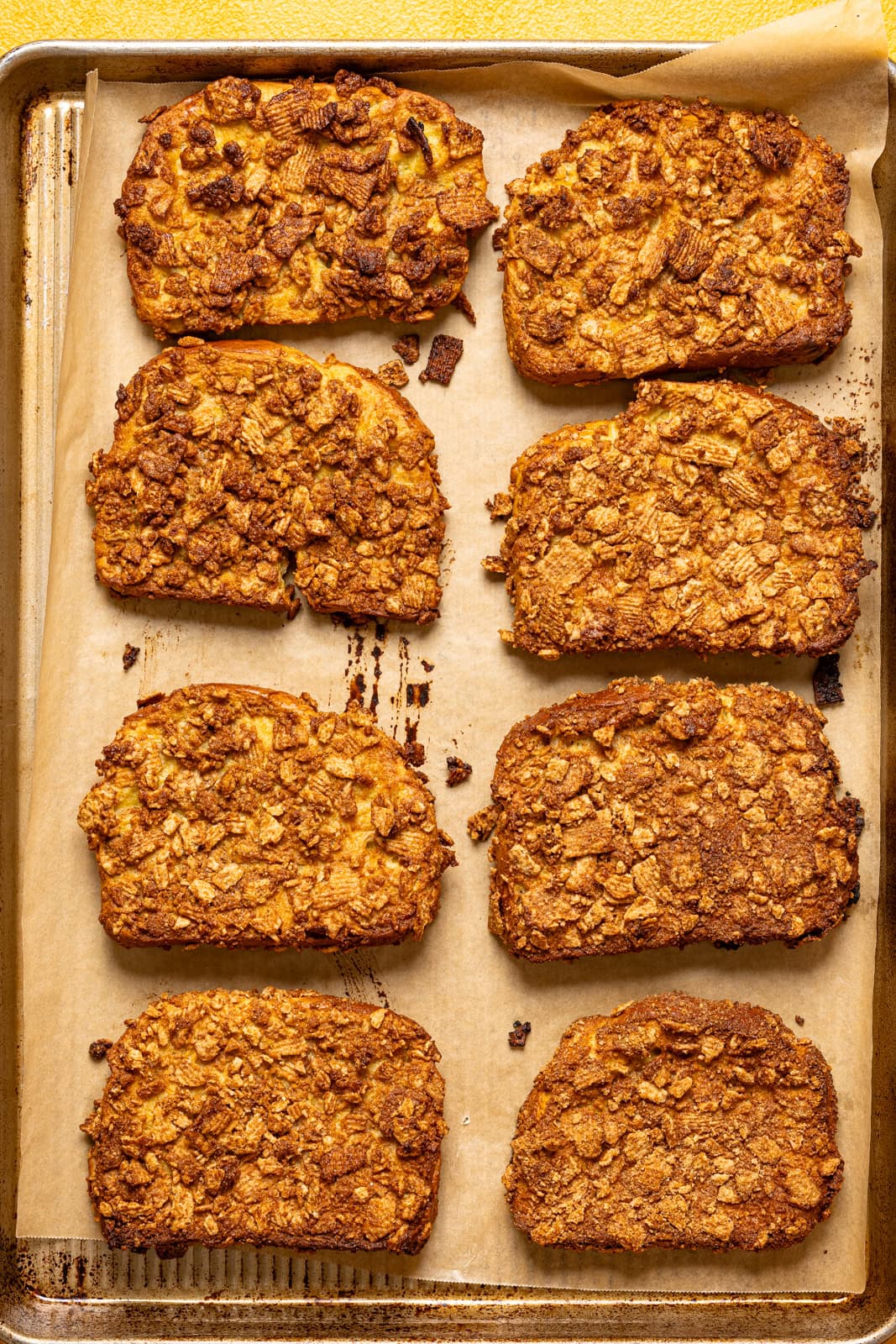 Baked french toast on a baking sheet with parchment paper.