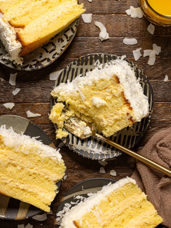 A cake slice being eaten with surrounding cake slices.