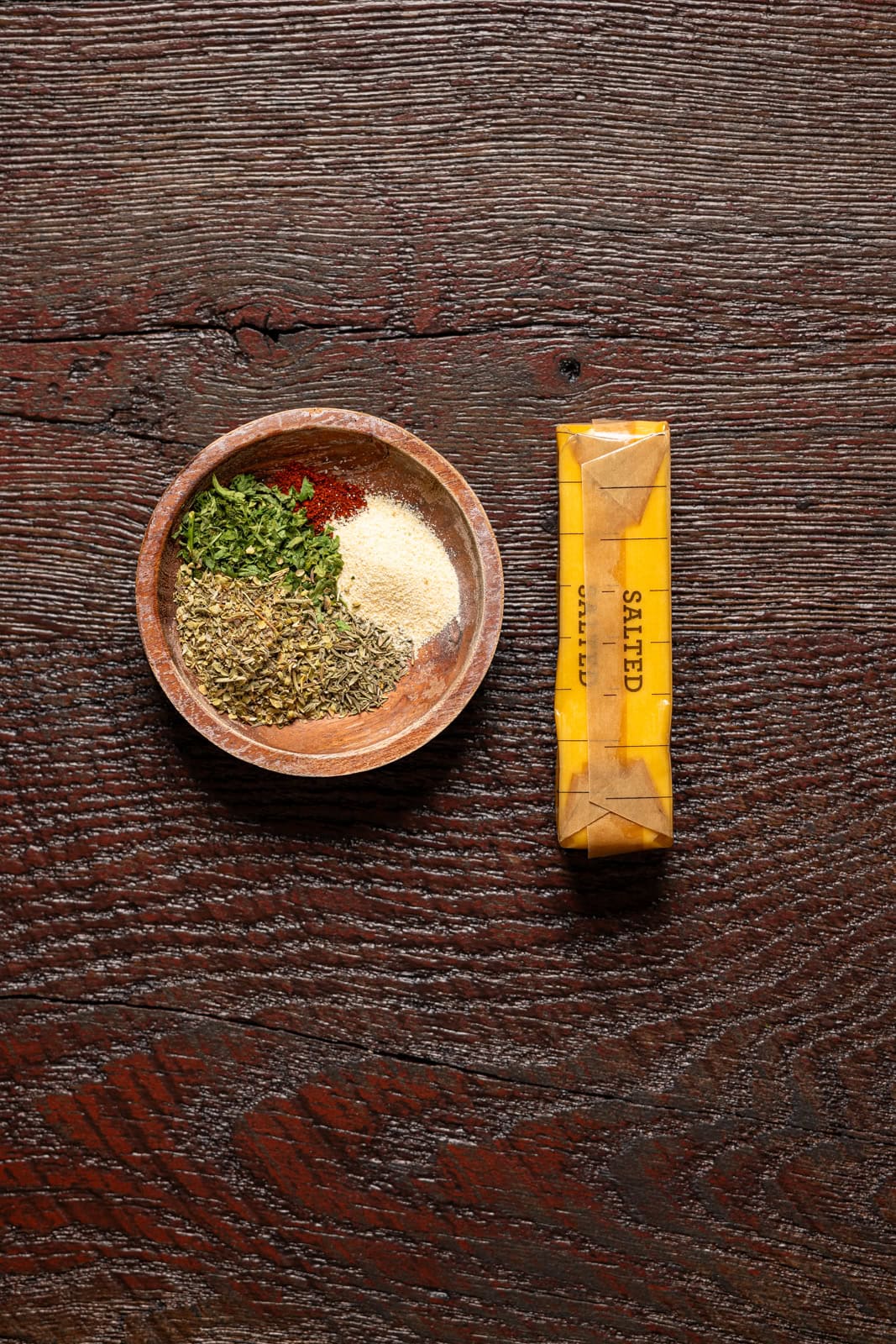 Ingredients on a dark brown wood table.
