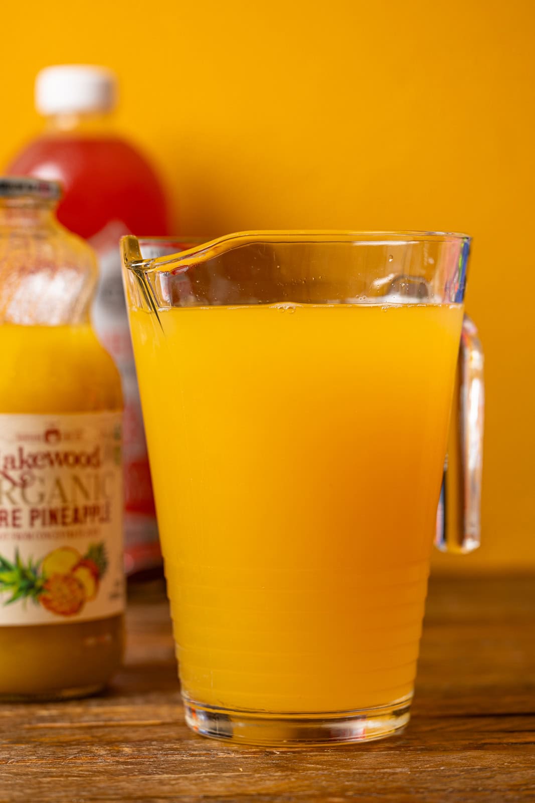 Lemonade on a brown wood table.