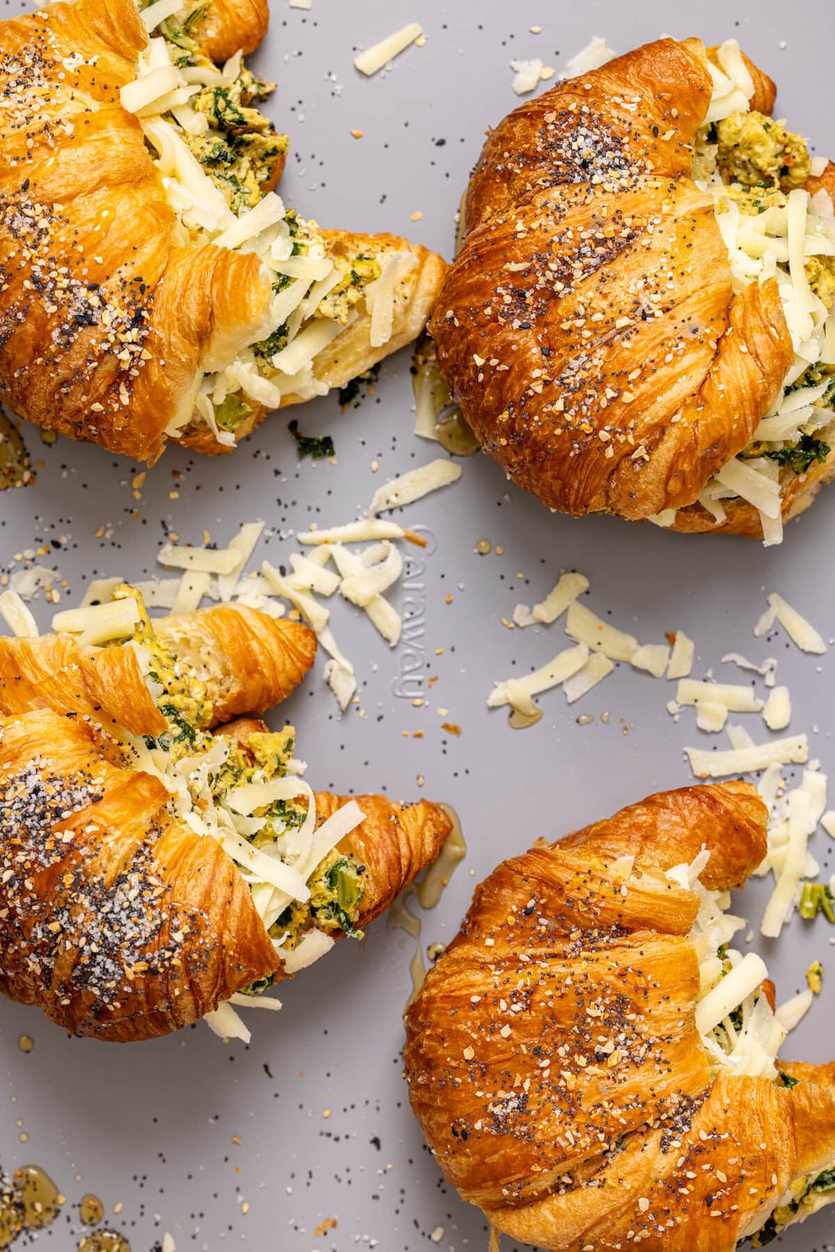 Stuffed croissants on a baking sheet.