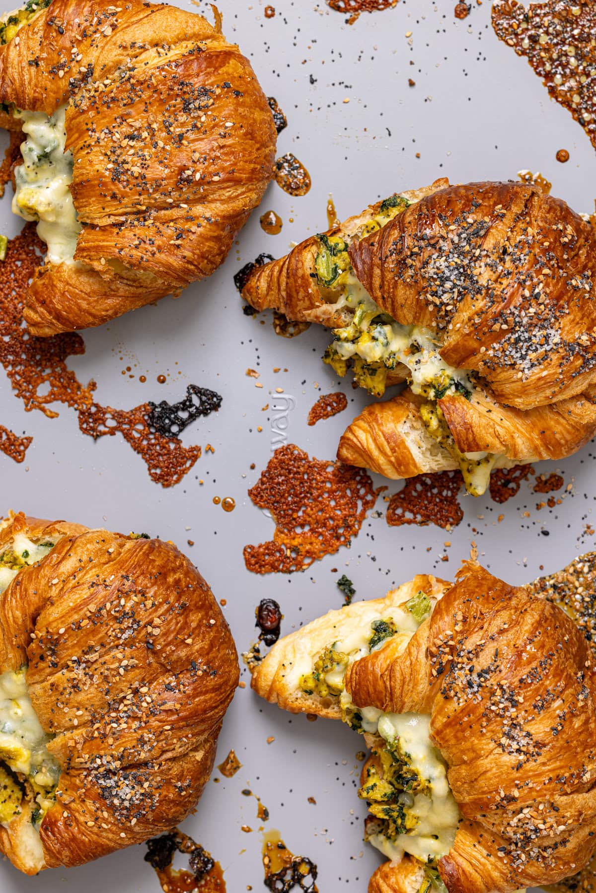 Baked croissants on a baking sheet.