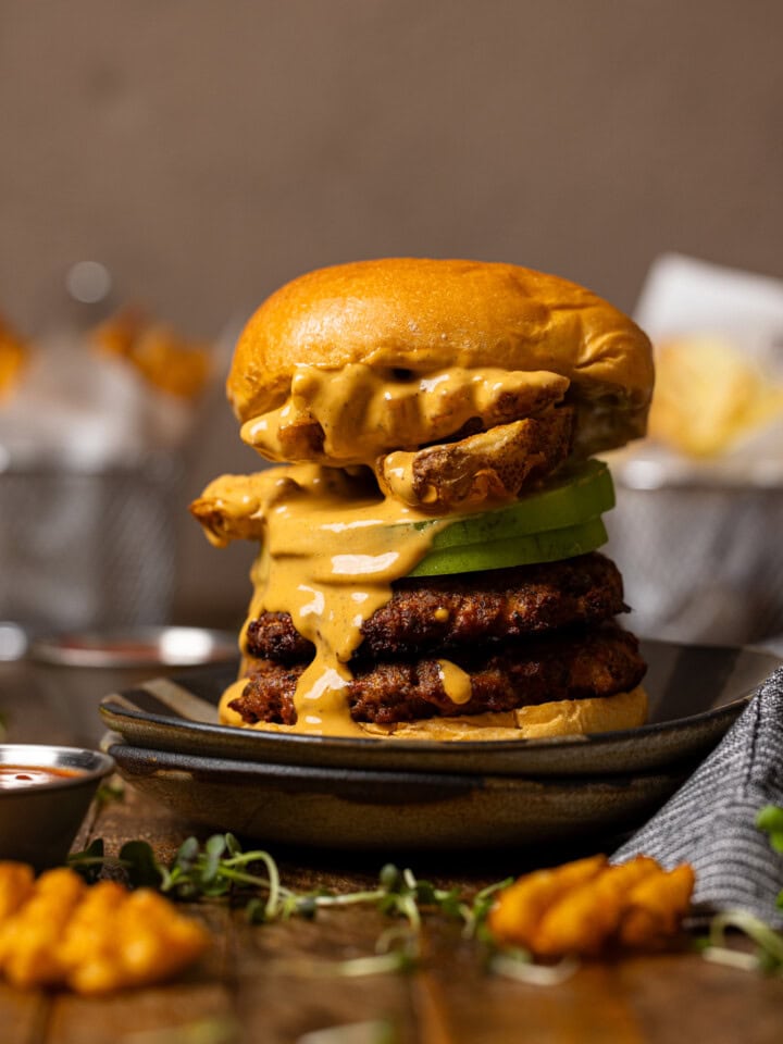 Smash burger with sauce and fries.