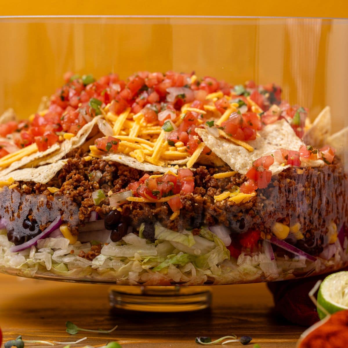 7-layer taco salad in a trifle bowl.
