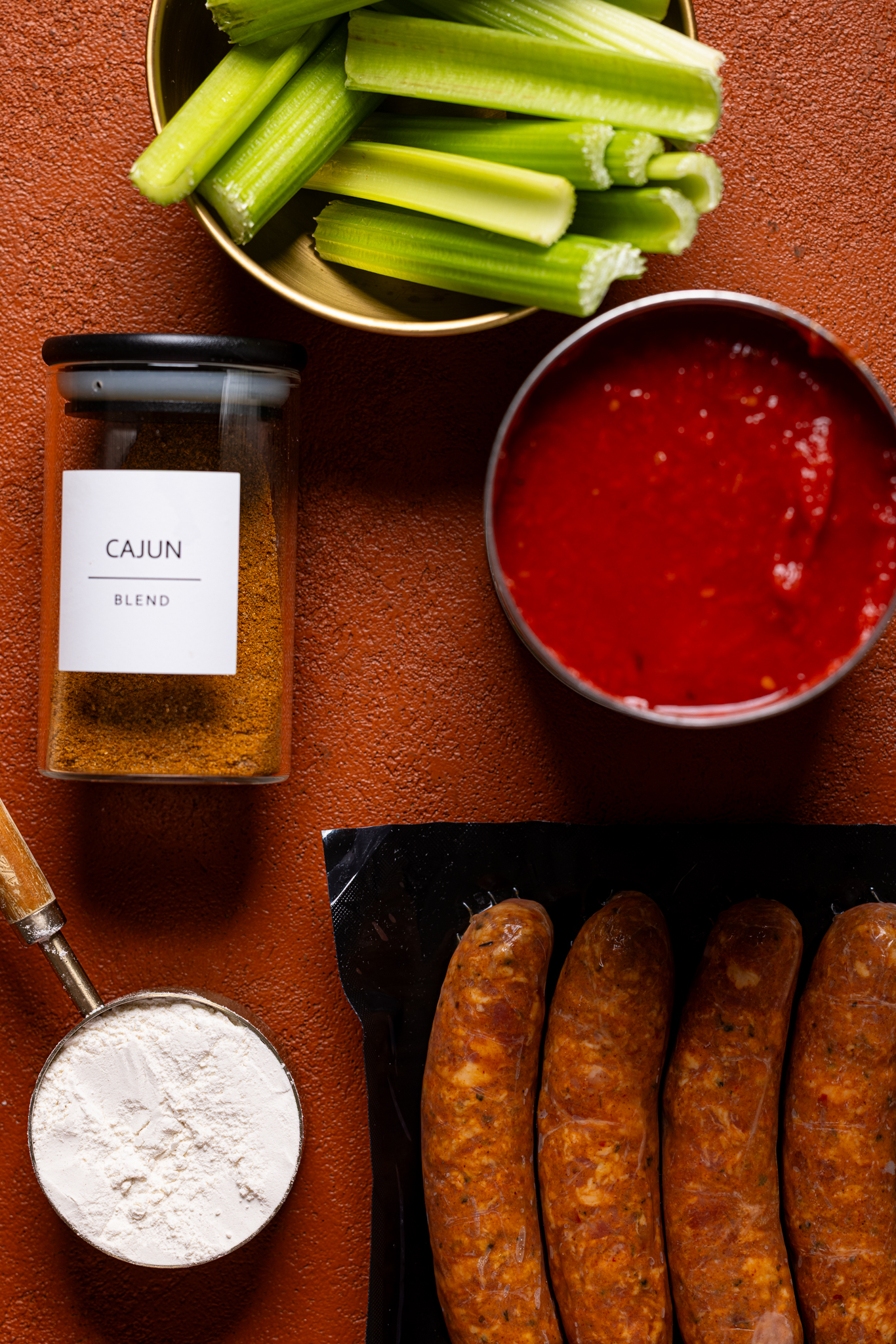 Ingredients on a burnt orange table.