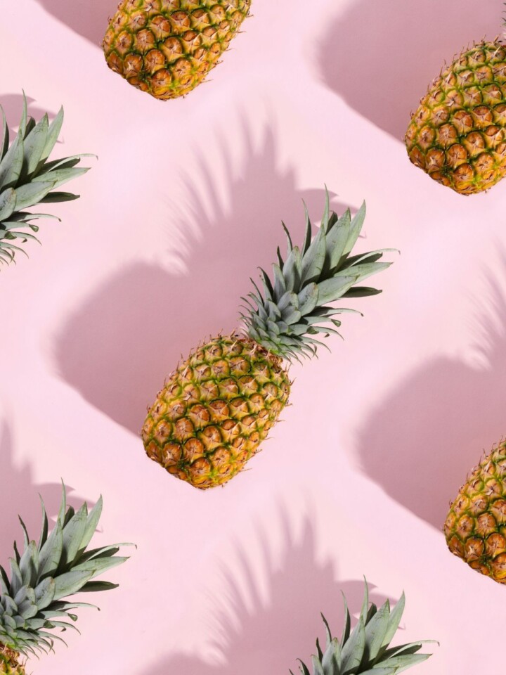 Pineapples on pink background