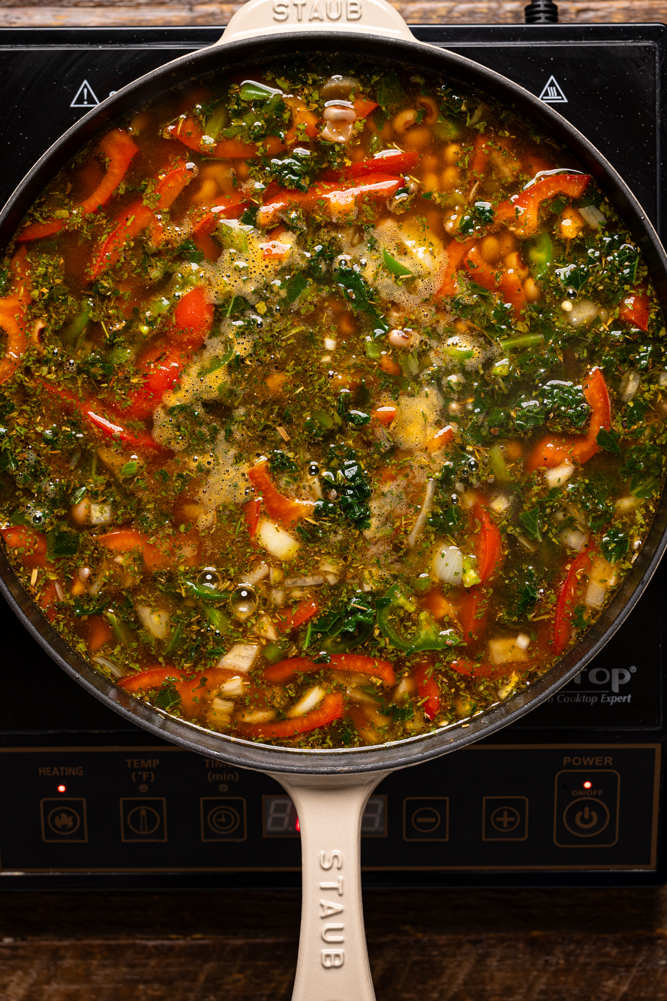 Image of ingredients being cooked in a skillet over the stovetop.
