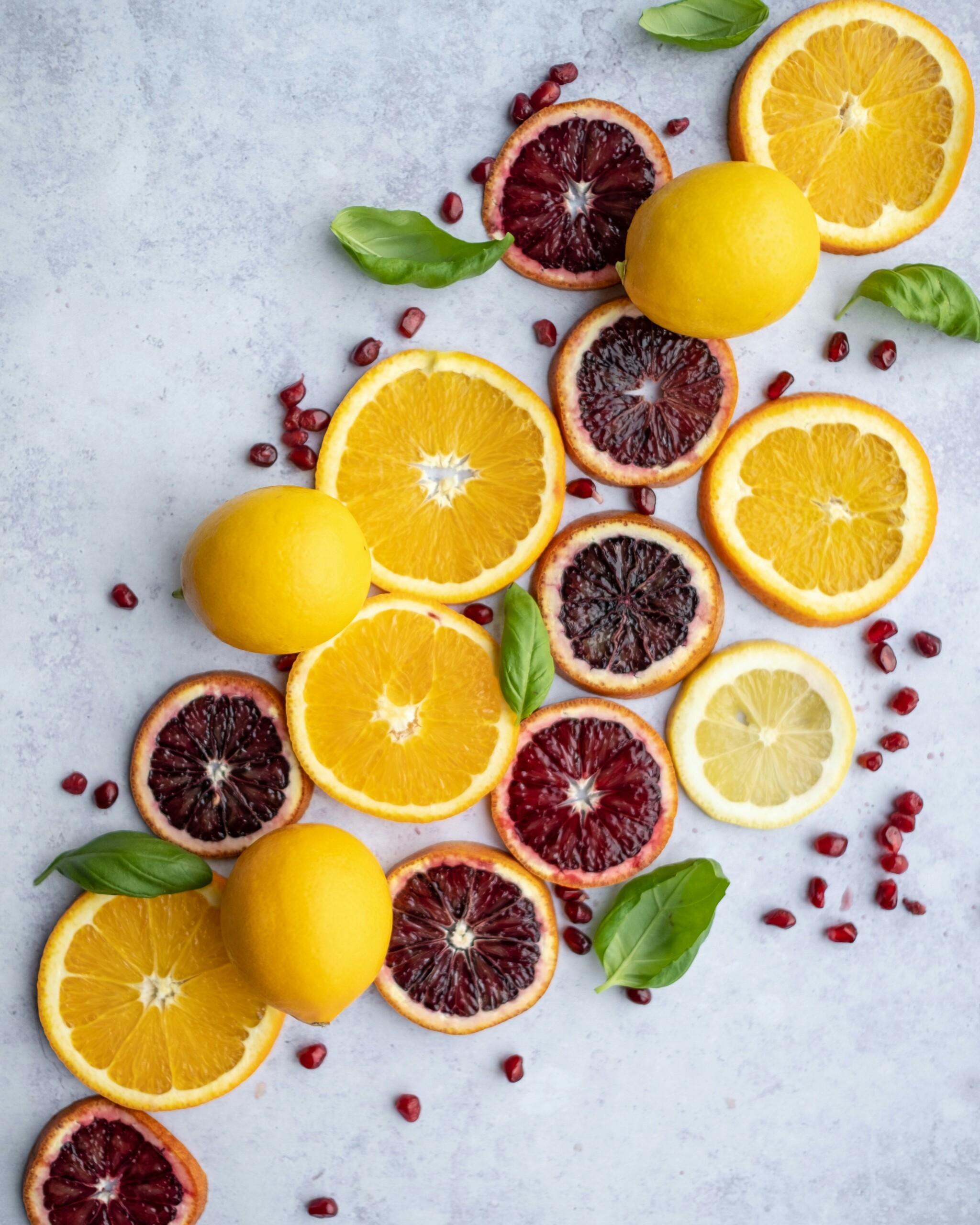 Different types of citrus cut open.