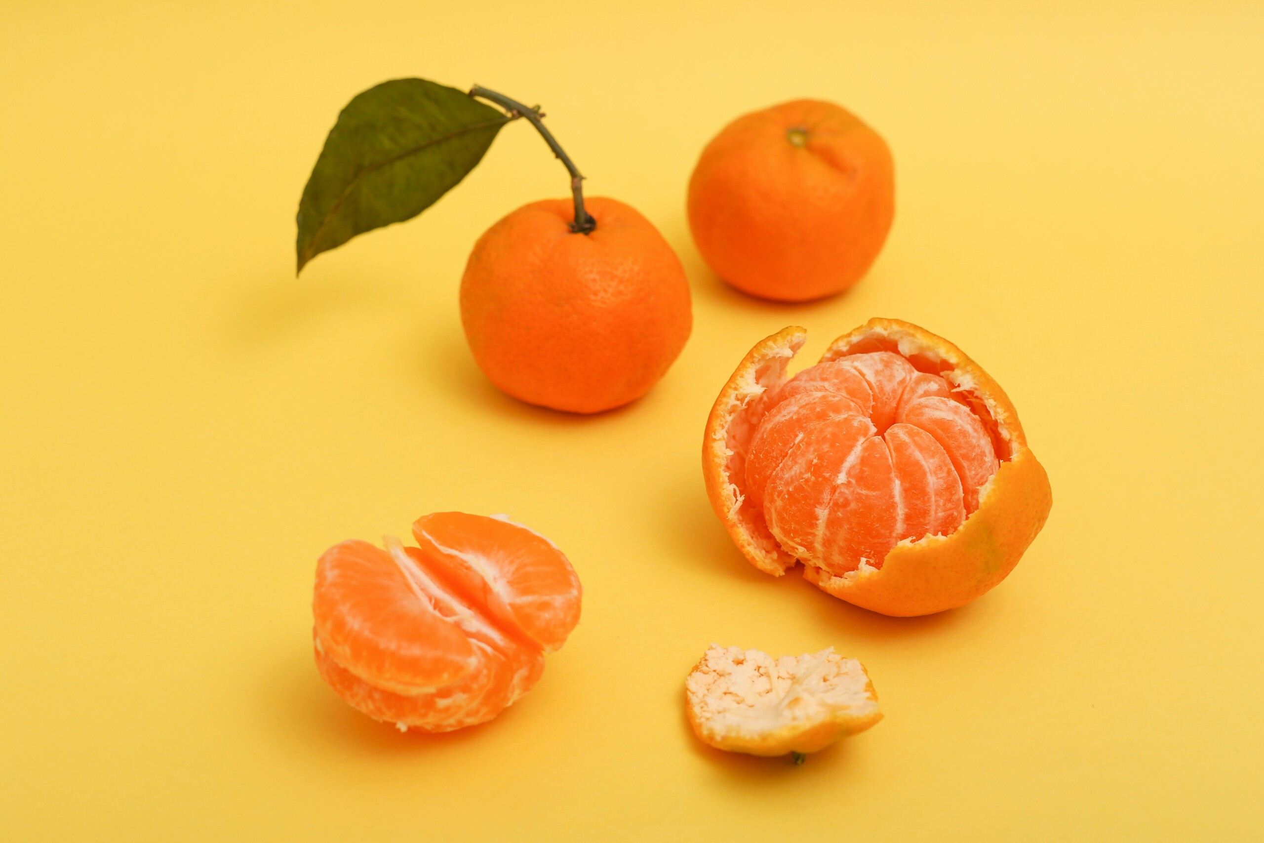 Tangerine half peeled.