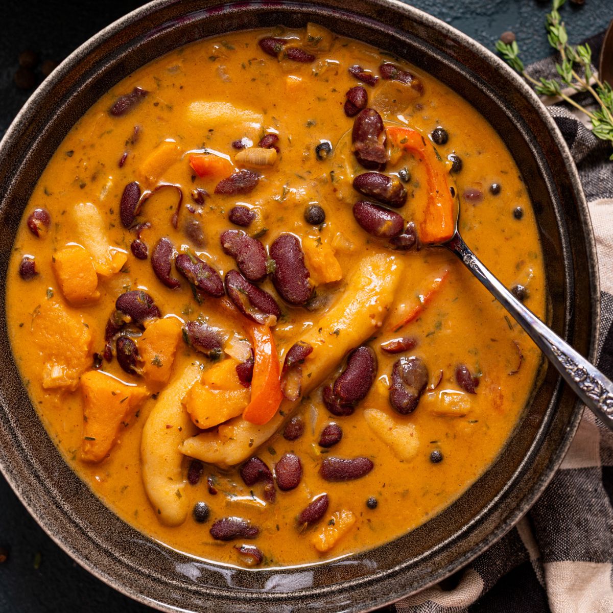 Up close shot of red peas soup in a bowl.
