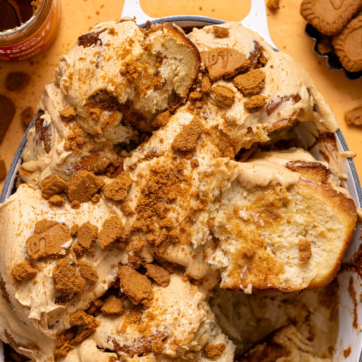 Biscoff Cookie Butter Cinnamon Rolls in a baking dish up close.