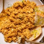 Up close shot of salmon dip on a plate.