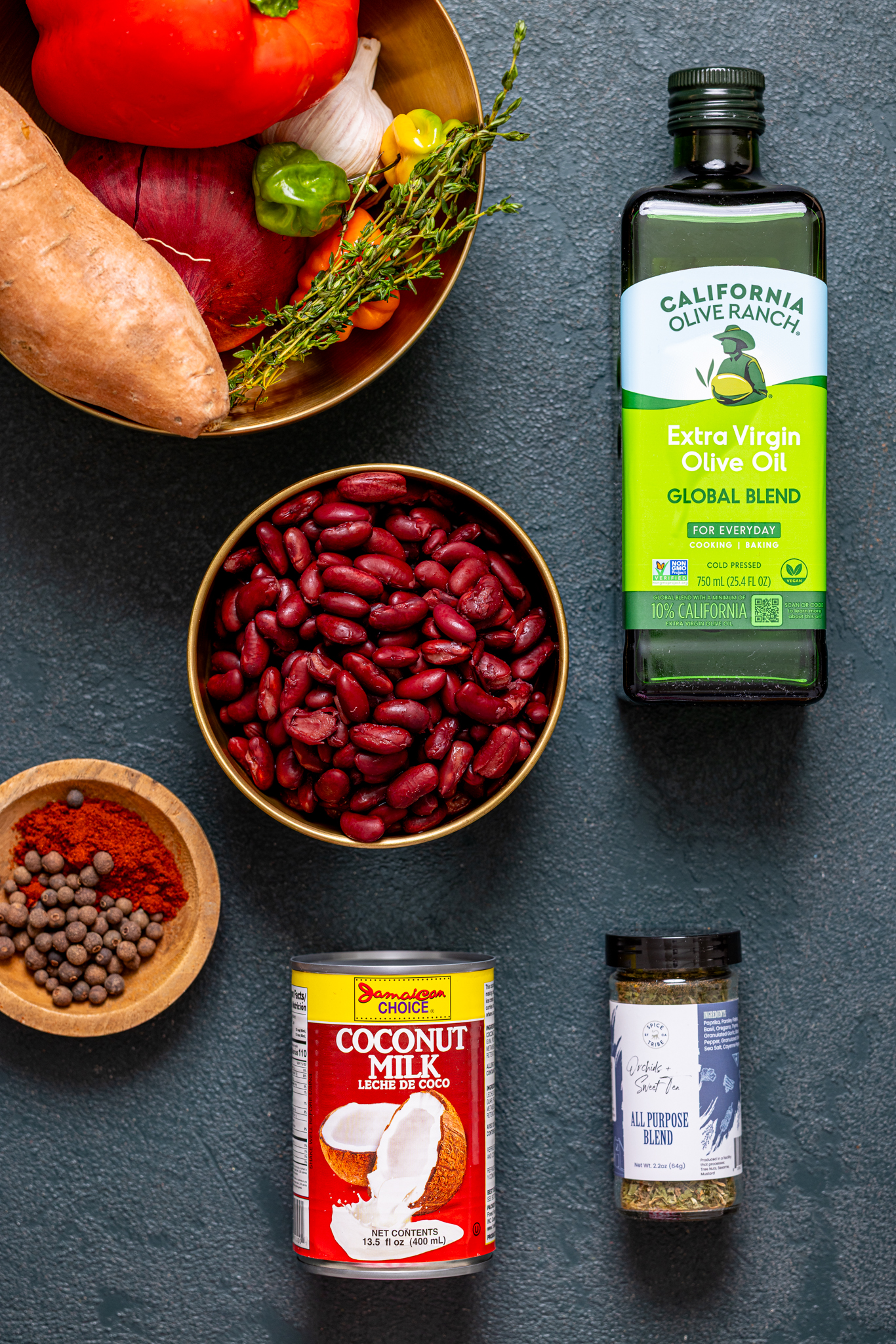 Ingredients on a hunter green table.