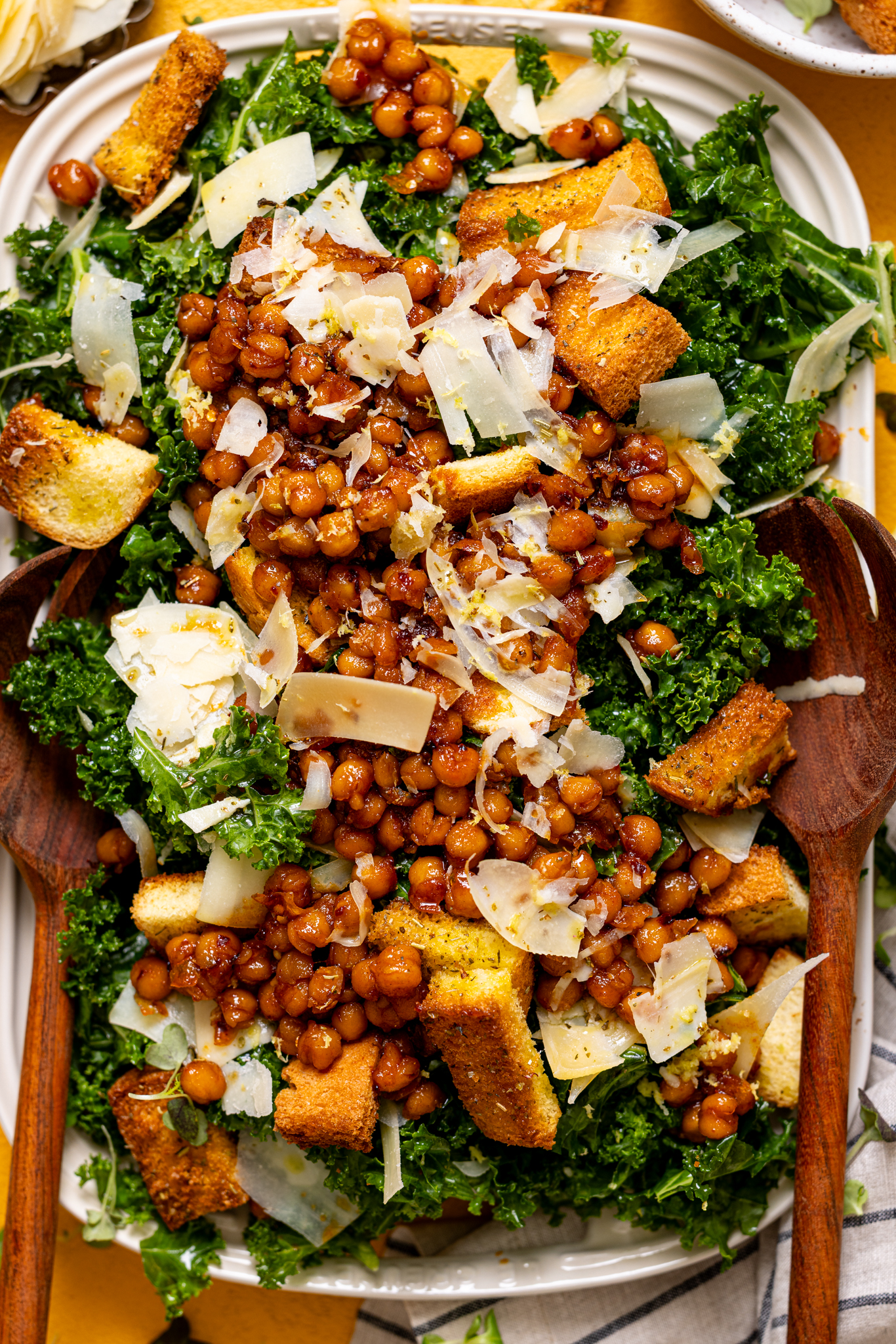 Up close shot of Lemon Parmesan Kale Salad with Hot Honey Chickpeas.