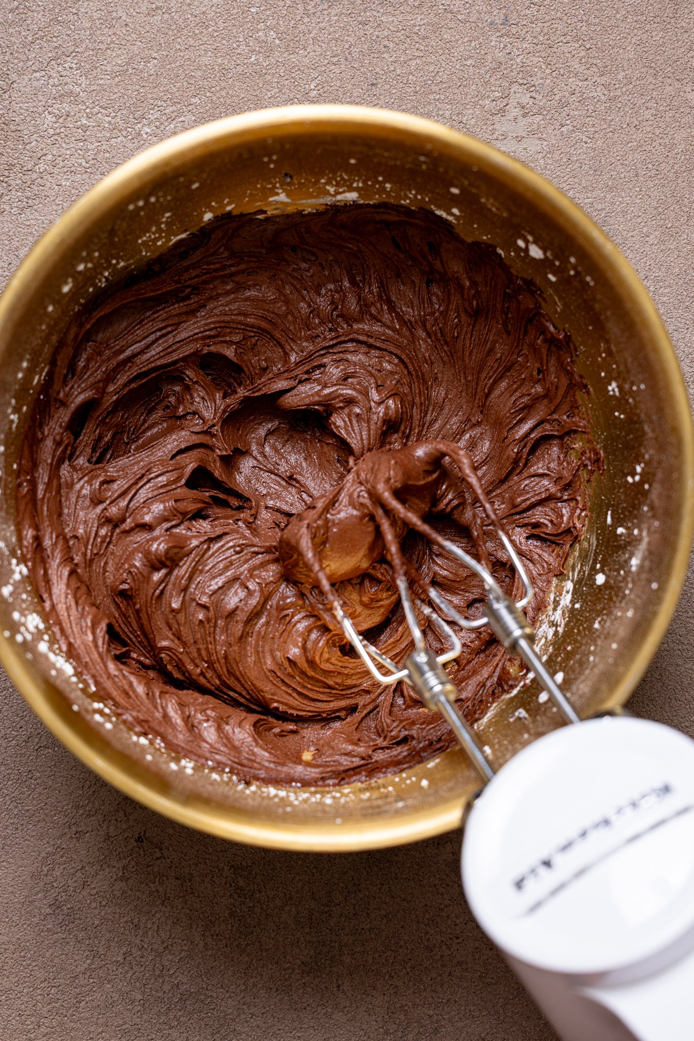Up close shot of Easy Whipped Chocolate Buttercream Frosting in a bowl.