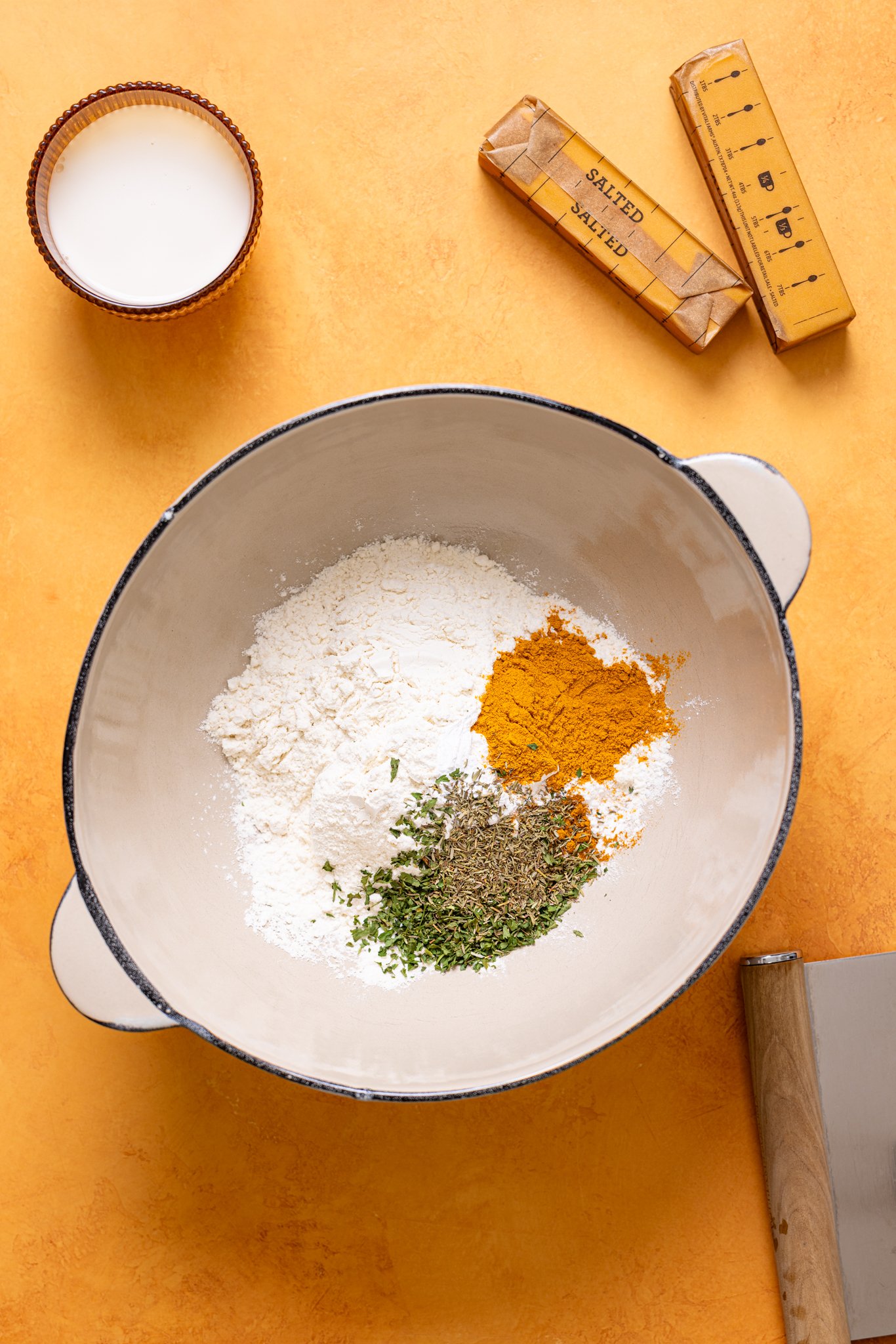 Ingredients on an orange table.
