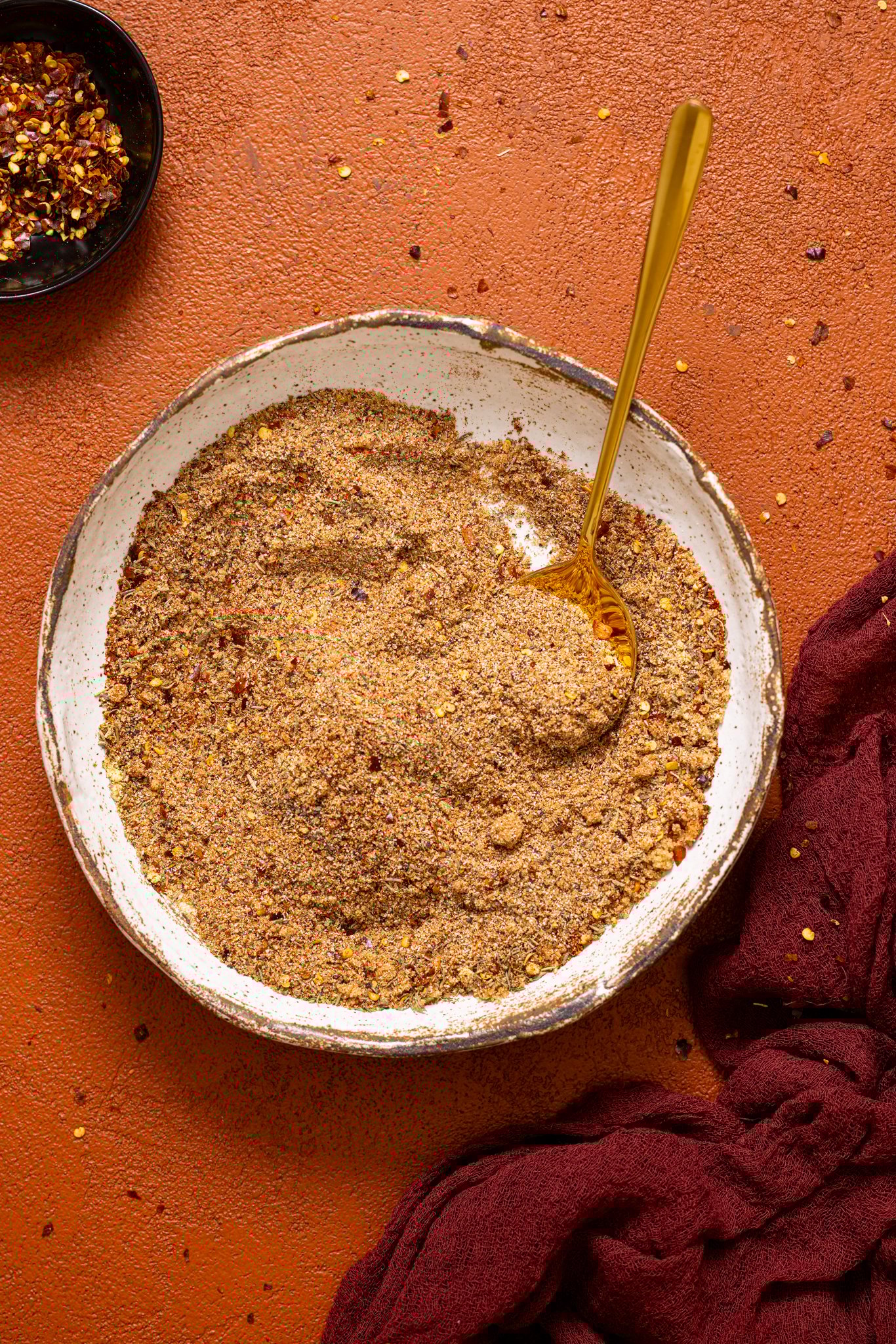 ‘On Everything’ BBQ Dry Rub Seasoning stirred together in a bowl.