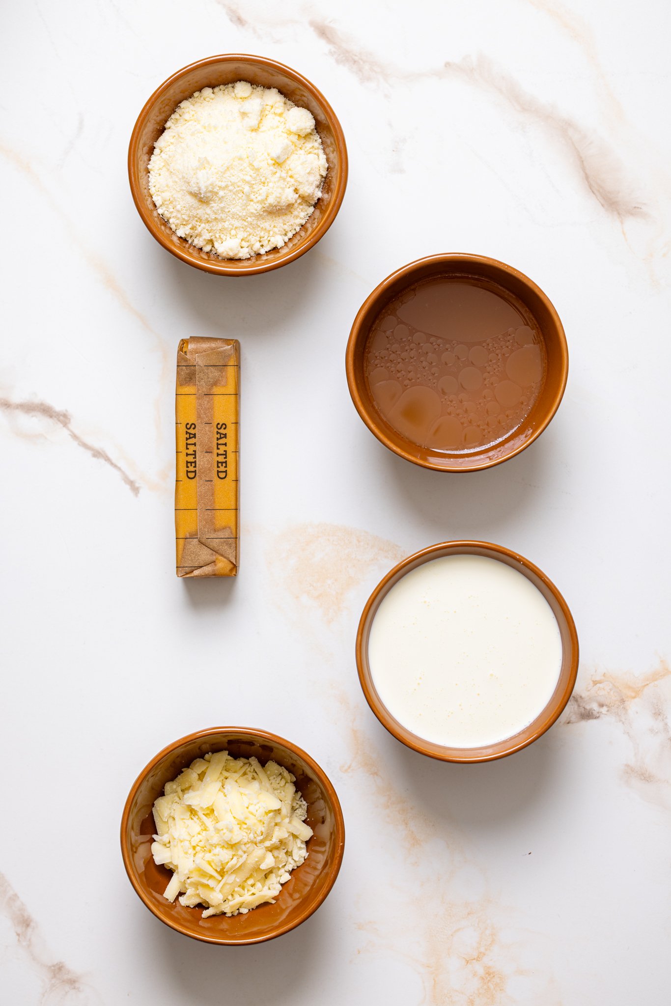 Ingredients on a white marble table.