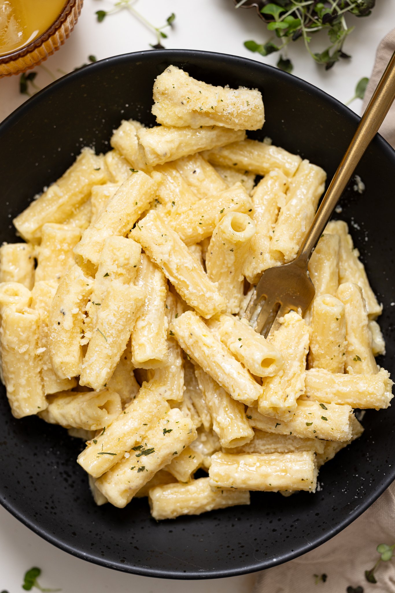 Up close shot of Creamy Weeknight Alfredo Pasta in a bowl with a fork.