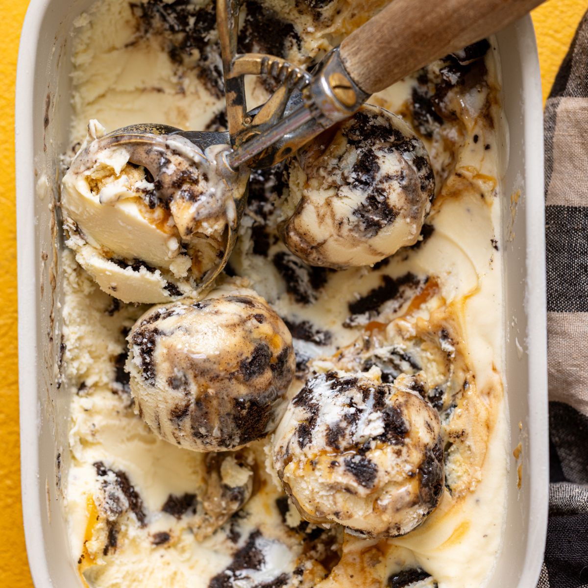 No-Churn Salted Caramel Oreo Ice Cream in a pan scooped.