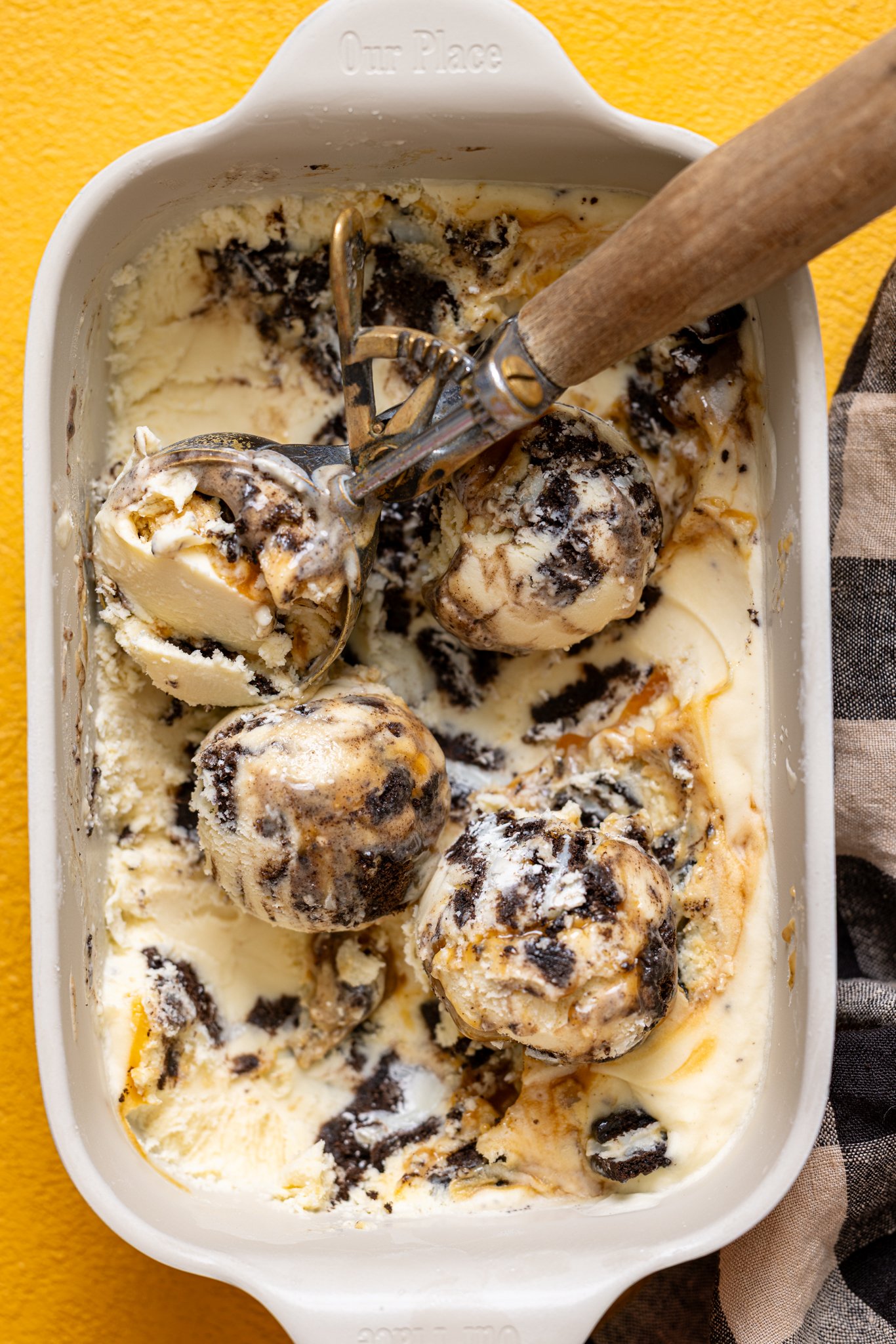 No-Churn Salted Caramel Oreo Ice Cream in a pan scooped.