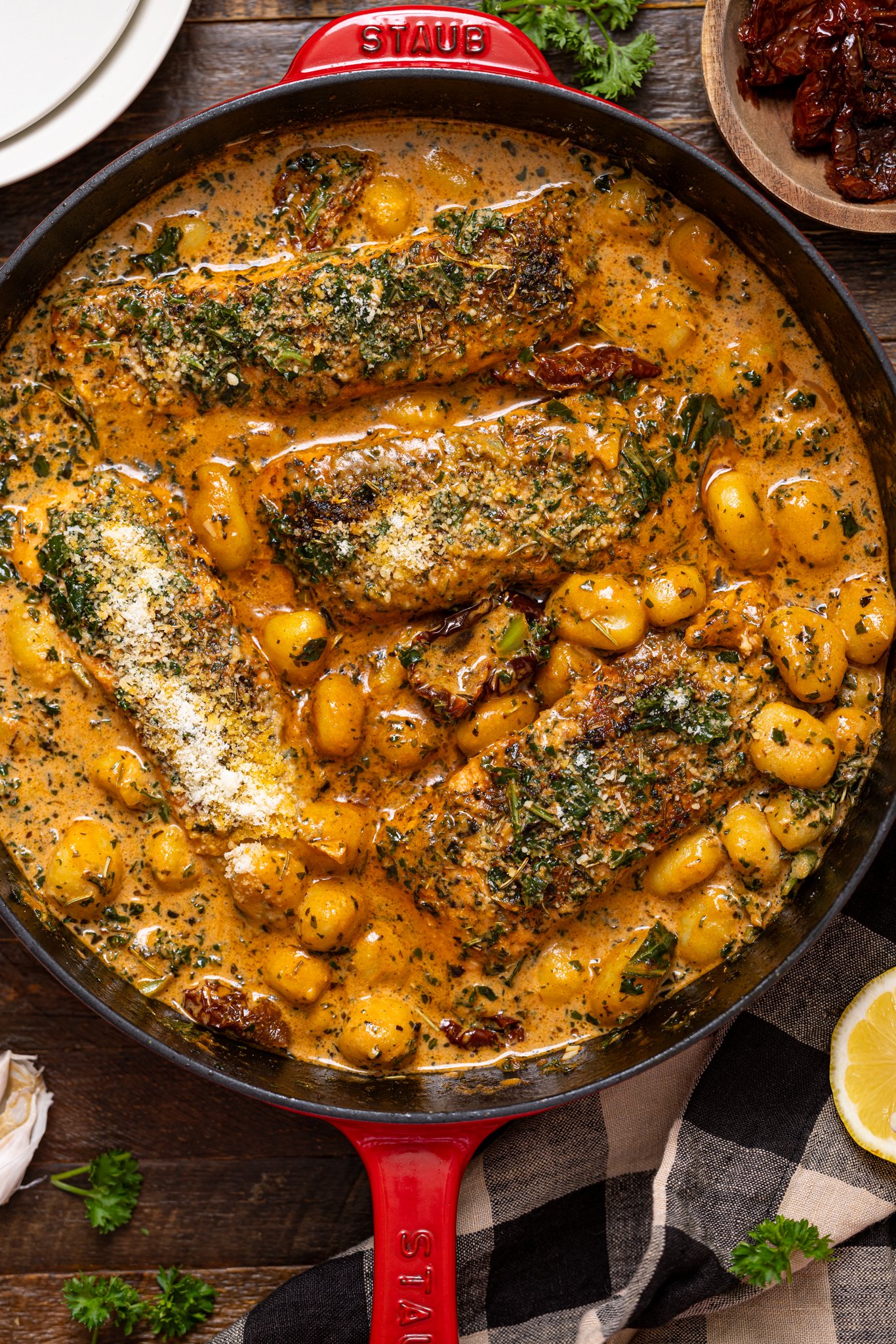 The Best Tuscan Marry Me Salmon in a skillet with gnocchi.