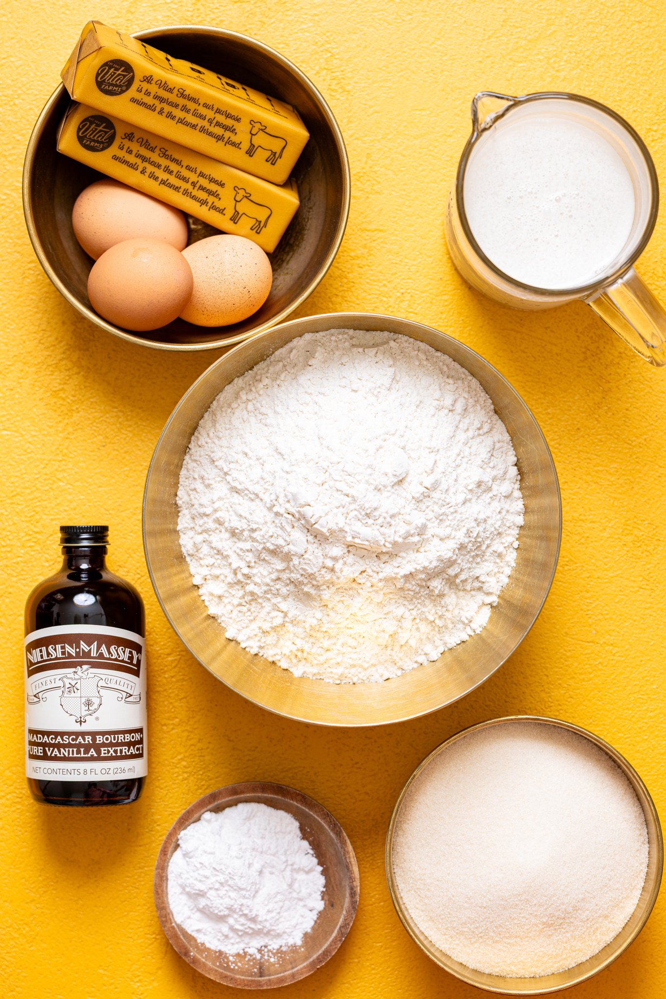 Ingredients on a yellow table.