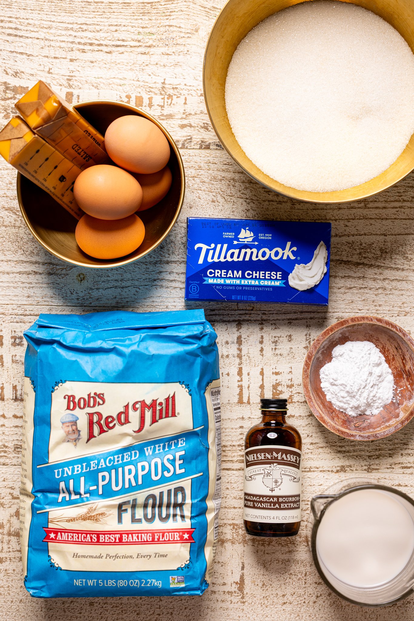 Ingredients on a white wood table.