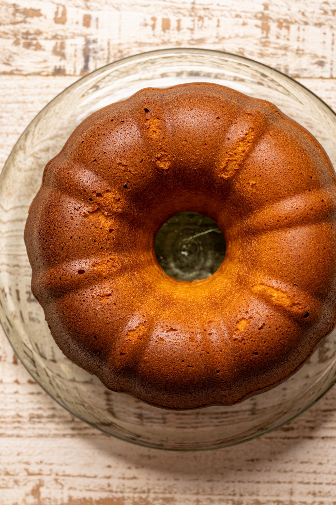 Baked Strawberry Shortcake Bundt Cake on a cake stand.