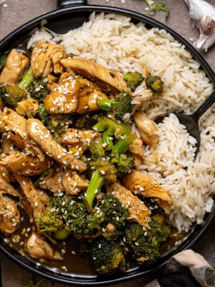 Up close shot of Take Out Honey Garlic Chicken on a plate with utensils.