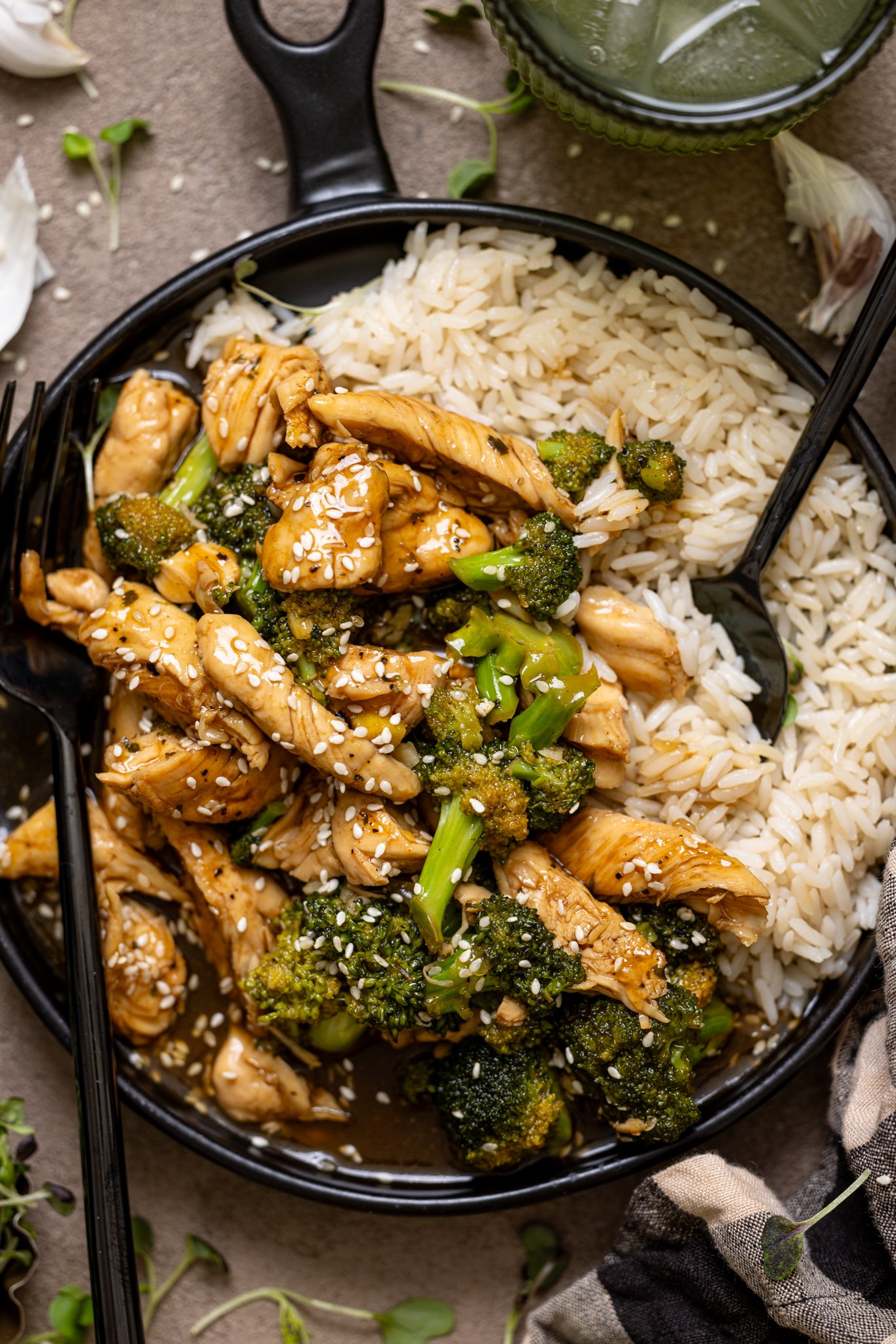 Up close shot of Take Out Honey Garlic Chicken on a plate with utensils. 