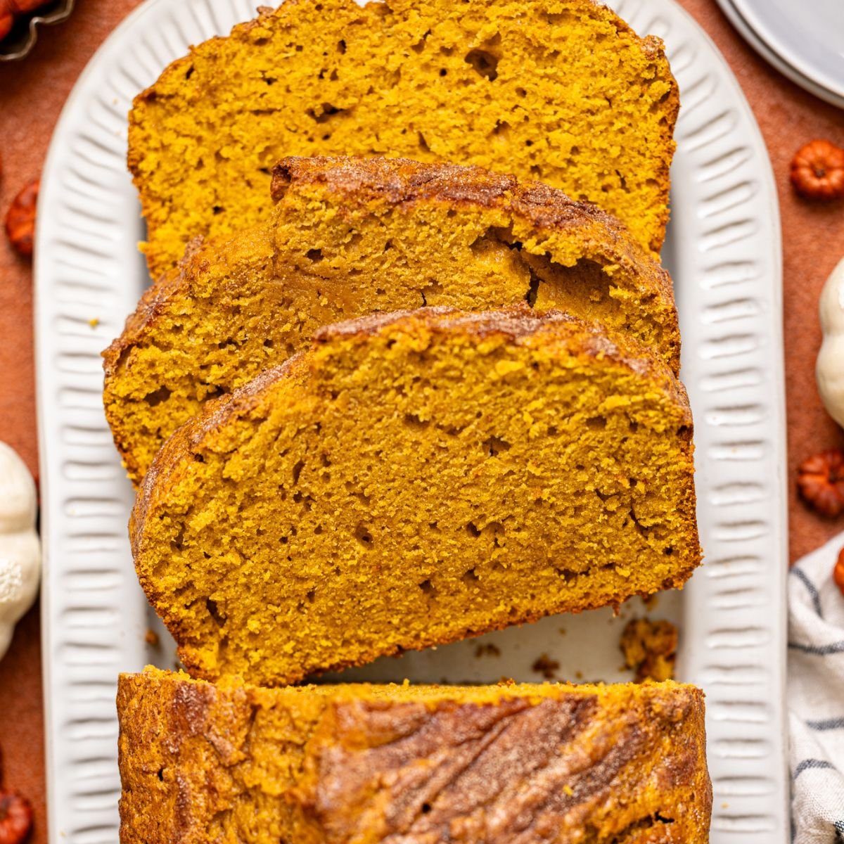 Comforting Pumpkin Chai Latte Bread sliced on a platter.