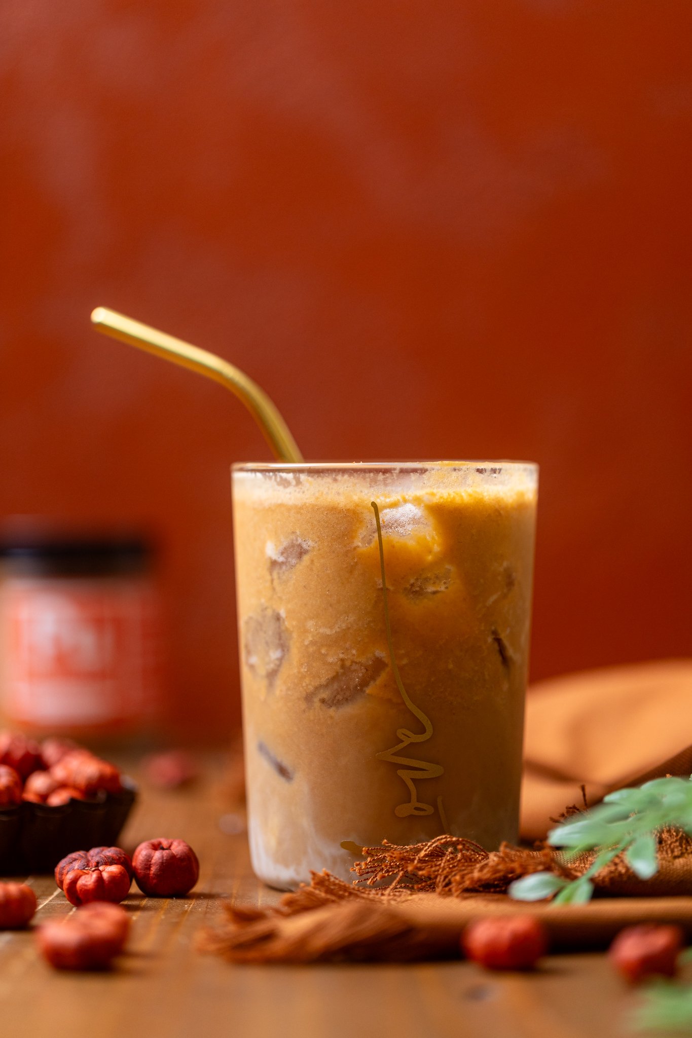 My Fave Pumpkin Dirty Chai Iced Latte in a glass with a straw.