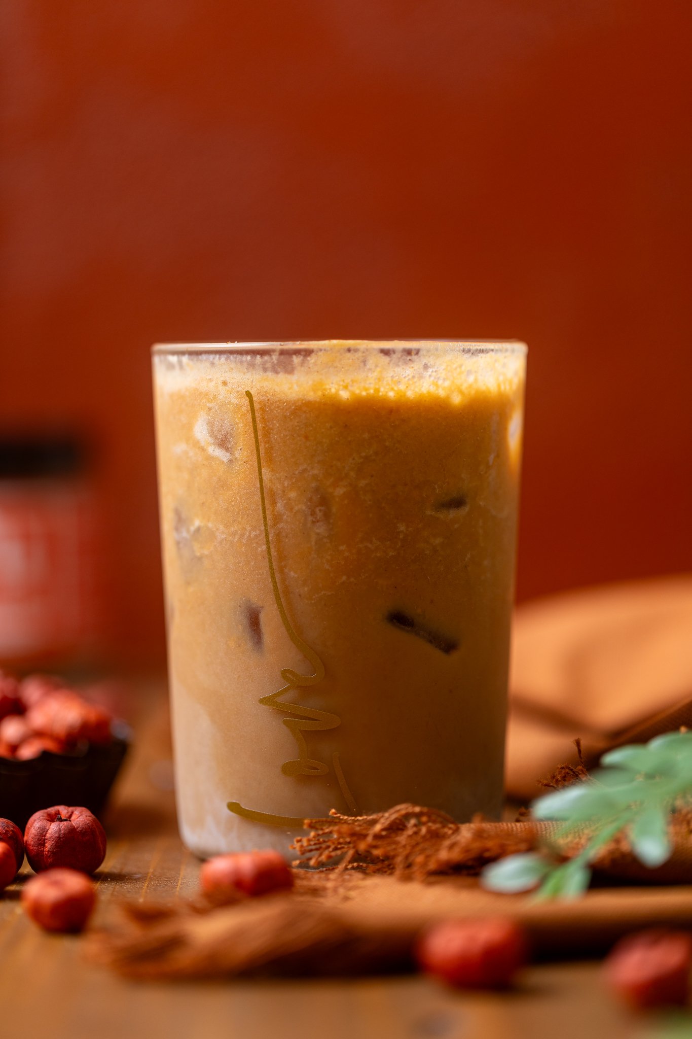 An up close shot of My Fave Pumpkin Dirty Chai Iced Latte.