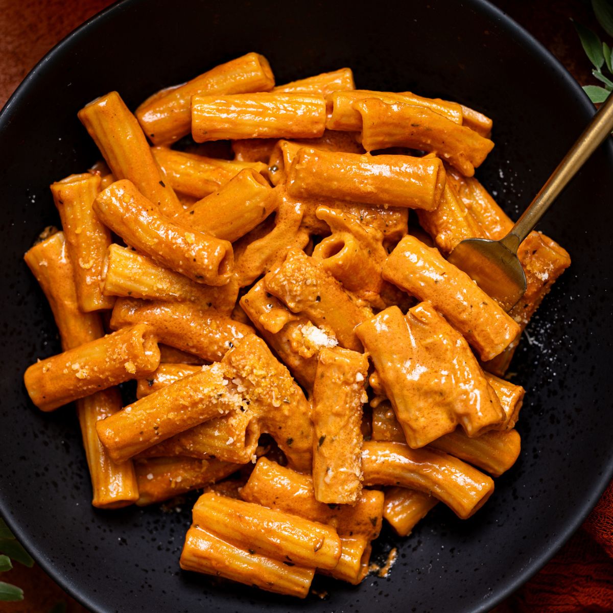Up close shot of My Go-to Weeknight Alla Vodka Pasta in a black plate with a fork.