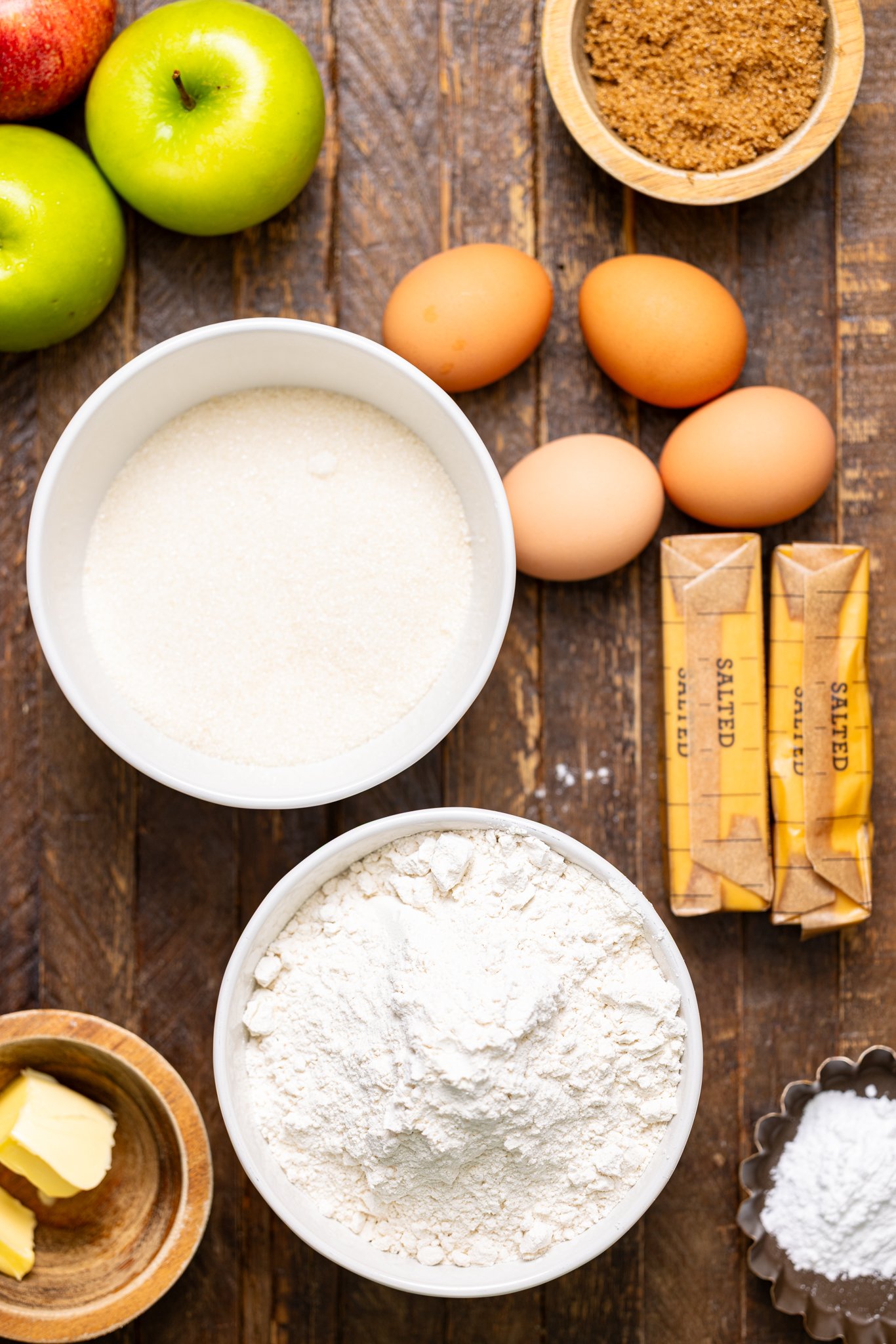 The ingredients on a brown wood table.