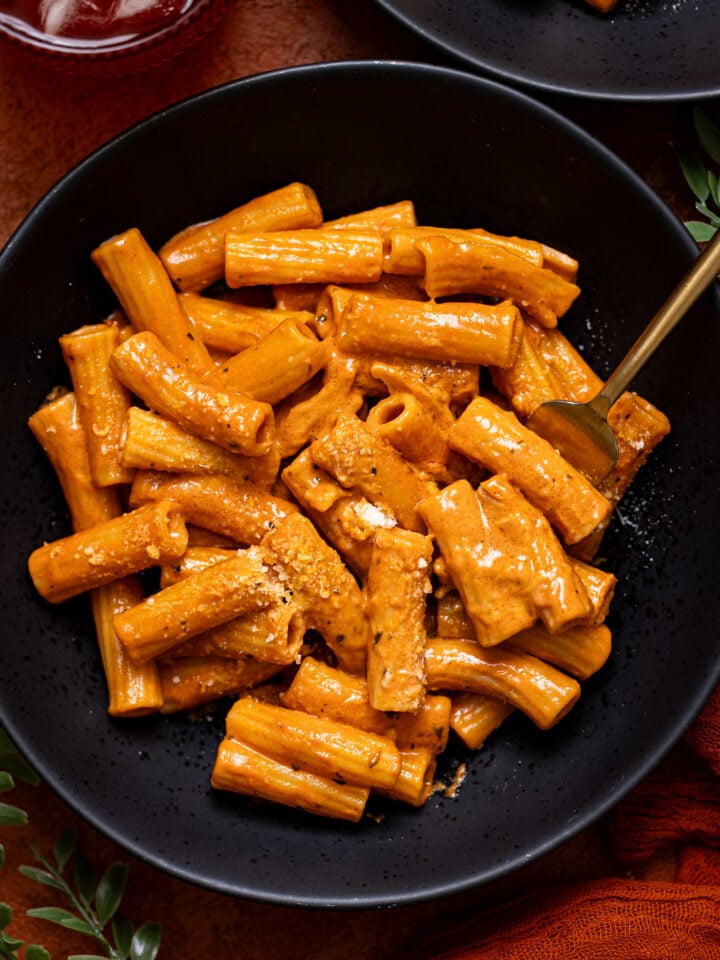 Up close shot of My Go-to Weeknight Alla Vodka Pasta in a black plate with a fork.